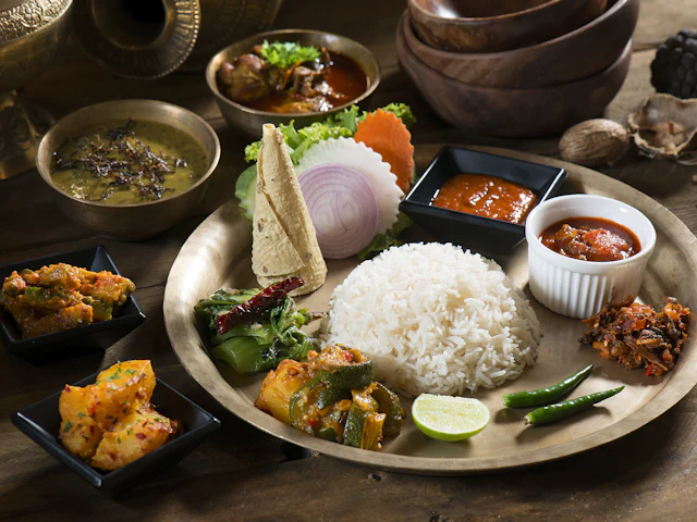A plate of cooked rice with mixed vegetables seen from above